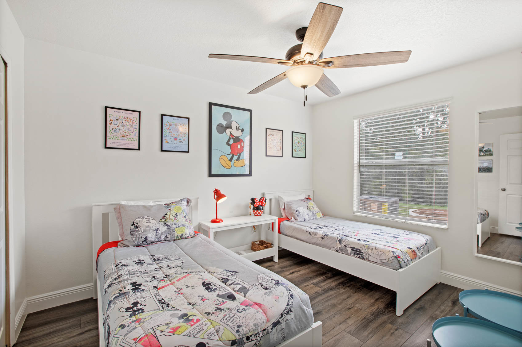 bedroom with two twin beds and mickey mouse theming